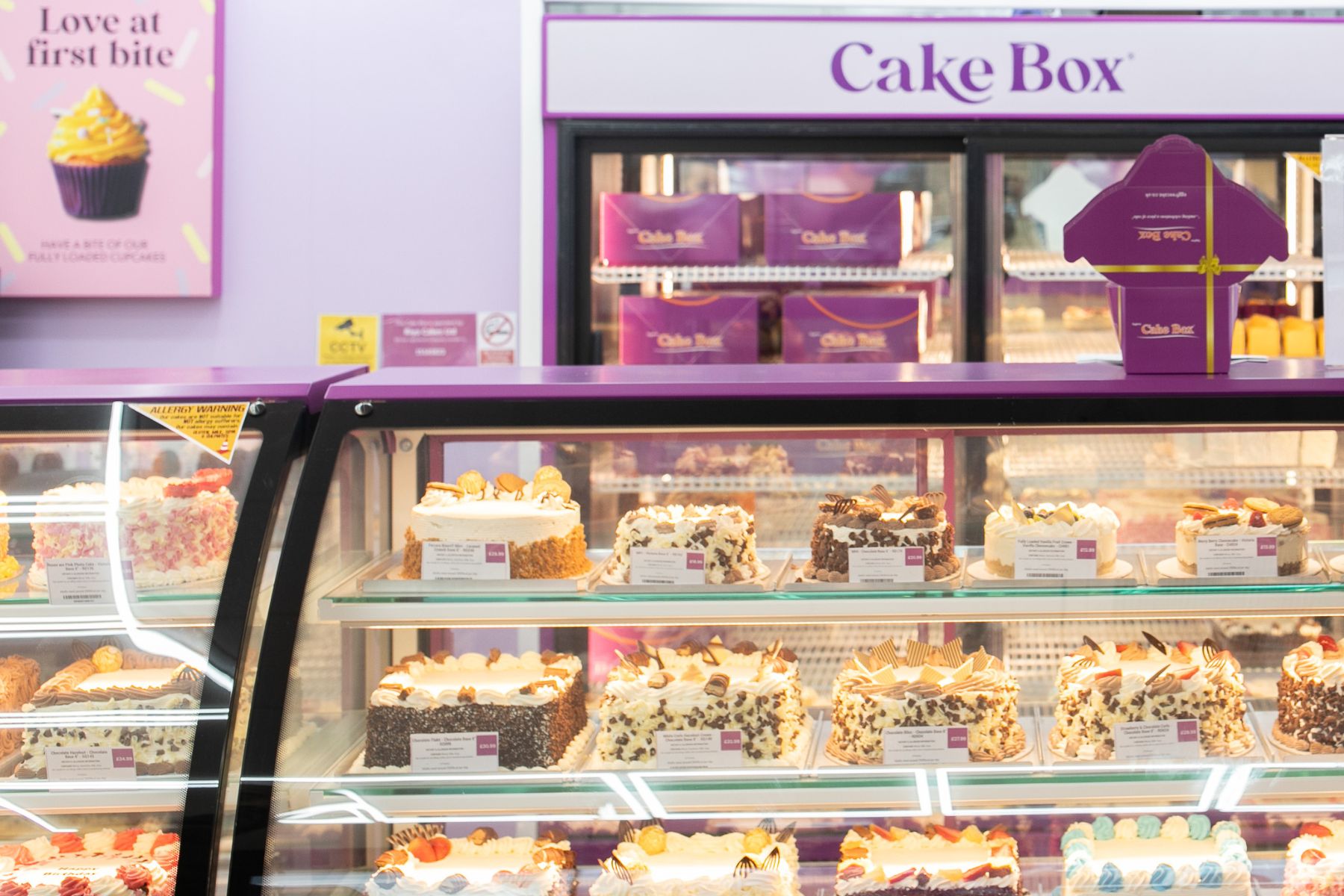 Cake box store display with many cakes